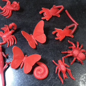 Red wax models of insects and butterflies